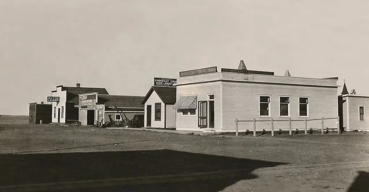 Main Street with Merchants Bank of Canada and early businesses, 1920